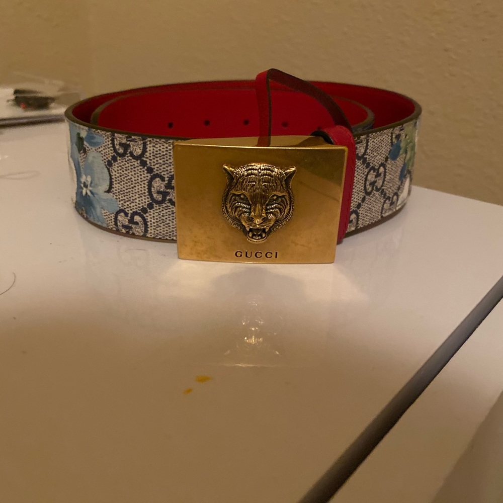 Floral Gucci belt with lion buckle